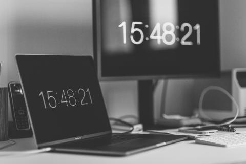 Image of time showing on two computers by Markus Spiske from Unsplash